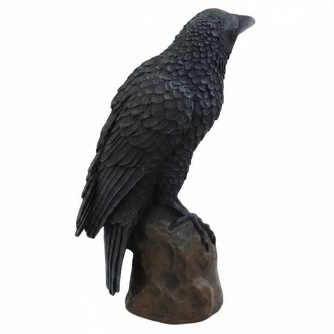 Black bird figurine on a white background